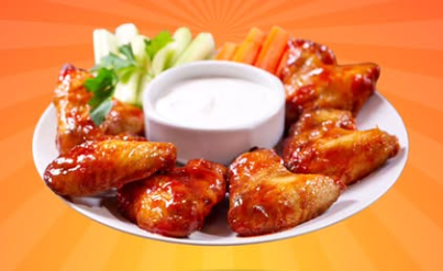 Wings with dipping sauce on a plate