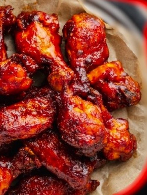 Saucy chicken wings close up
